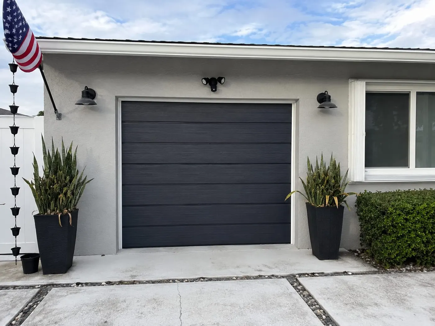 Design option: dark gray flush panel garage door on a contemporary home